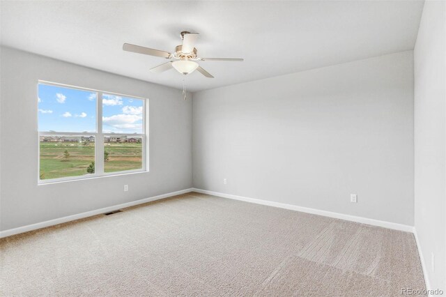 973 Cascade Falls St, Severance, CO 80550 - spare room featuring a ceiling fan, light carpet, and baseboards