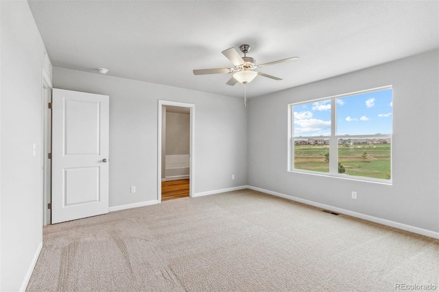 973 Cascade Falls St, Severance, CO 80550 - unfurnished bedroom featuring carpet floors, baseboards, ensuite bath, and ceiling fan