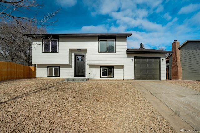 raised ranch featuring a garage