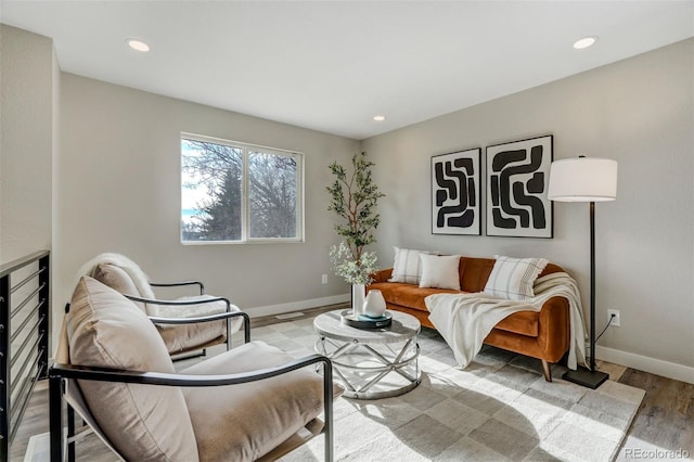 living area with hardwood / wood-style flooring