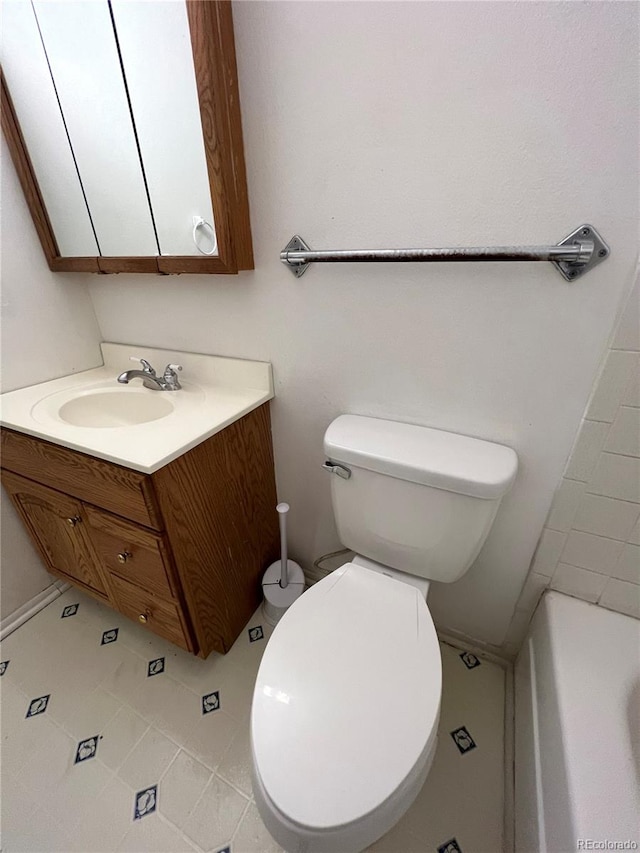 bathroom with vanity and toilet