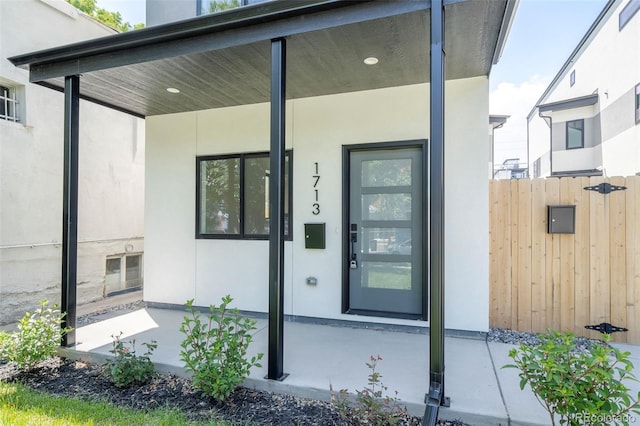 1713 Grove St, Denver, CO 80204 - property entrance featuring stucco siding