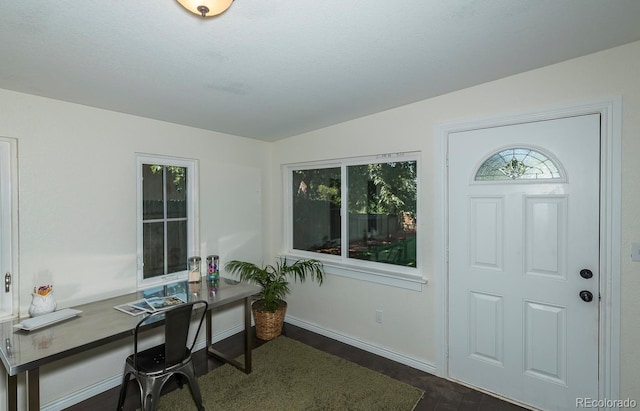 office area with vaulted ceiling and dark wood-type flooring