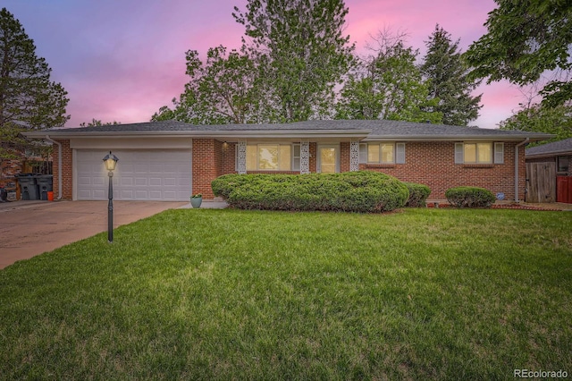 13558 E Center Ave, Aurora, CO 80012 - single story home with an attached garage, brick siding, and driveway