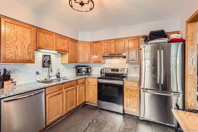 13558 E Center Ave, Aurora, CO 80012 - kitchen with appliances with stainless steel finishes, a sink, under cabinet range hood, tasteful backsplash, and light stone counters