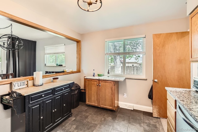 13558 E Center Ave, Aurora, CO 80012 - bathroom with a chandelier and baseboards