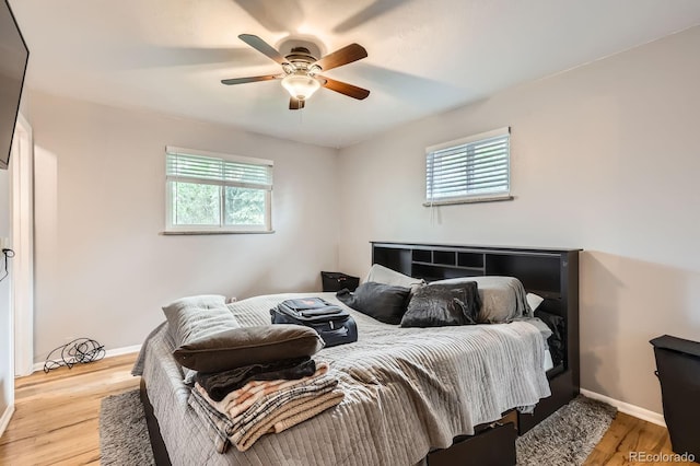 13558 E Center Ave, Aurora, CO 80012 - bedroom with baseboards, wood finished floors, and ceiling fan