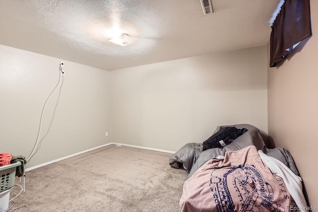 13558 E Center Ave, Aurora, CO 80012 - bedroom with carpet, a textured ceiling, and baseboards