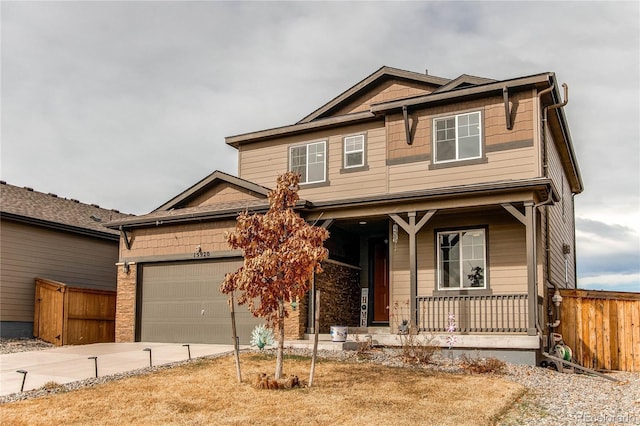 craftsman-style house featuring fence, driveway, a porch, and a garage