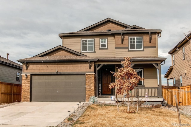15920 Hayloft Ln, Parker, CO 80134 - craftsman-style home with covered porch, fence, and driveway