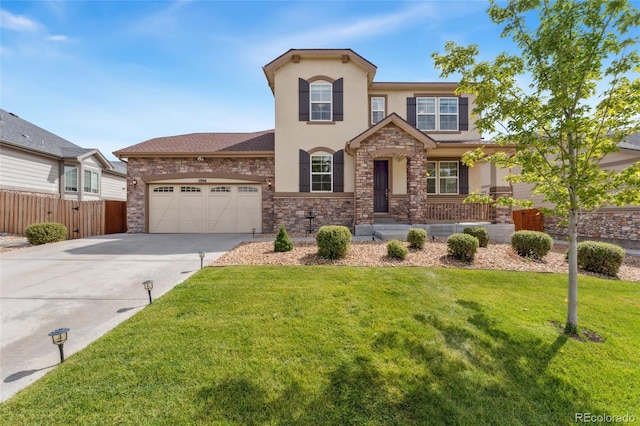 view of front of property featuring a front yard and a garage