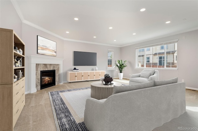 living room with ornamental molding, light carpet, and a tiled fireplace