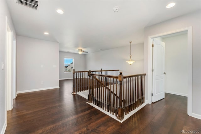 hall featuring dark wood-type flooring