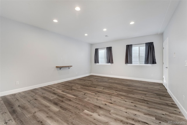 empty room with hardwood / wood-style flooring