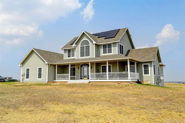 country-style home with a porch and a front lawn