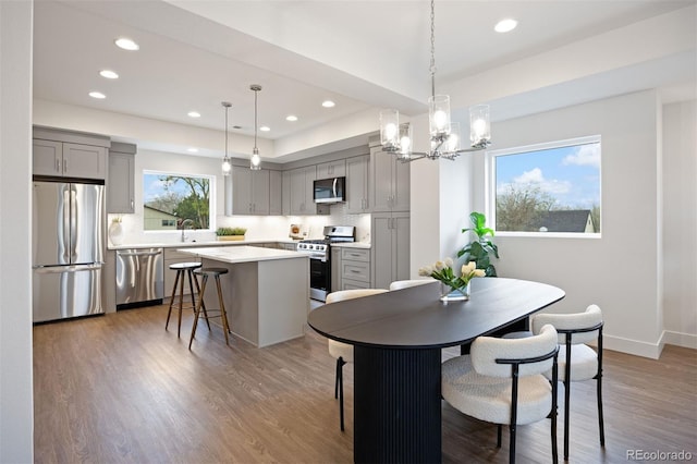 8410 W 52nd Ave, Arvada, CO 80002 - dining area with recessed lighting, a chandelier, wood finished floors, and baseboards