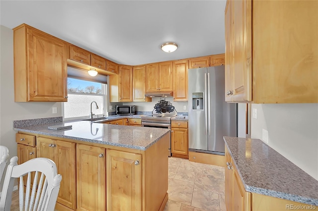 kitchen with stone countertops, sink, light tile patterned floors, and stainless steel appliances