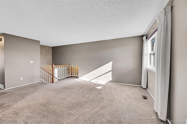 8160 W 81st Pl, Arvada, CO 80005 - carpeted spare room featuring a textured ceiling and baseboards
