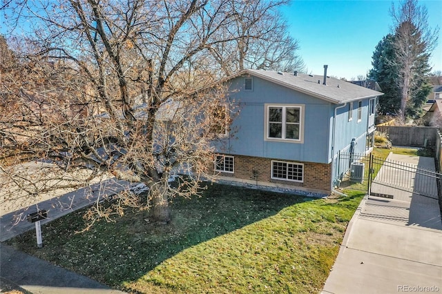 view of home's exterior featuring a yard and central air condition unit