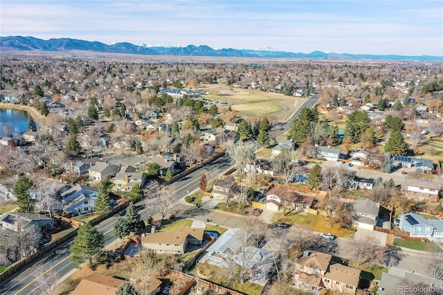 birds eye view of property featuring a water and mountain view