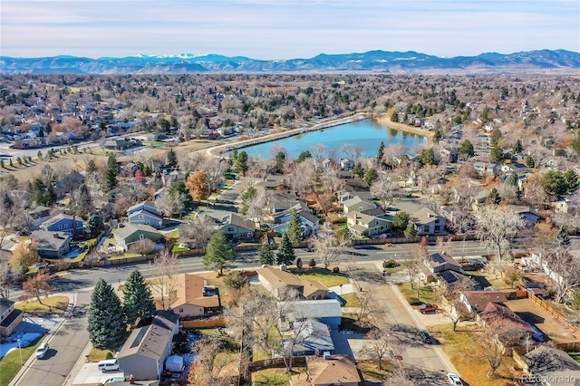 bird's eye view with a water and mountain view