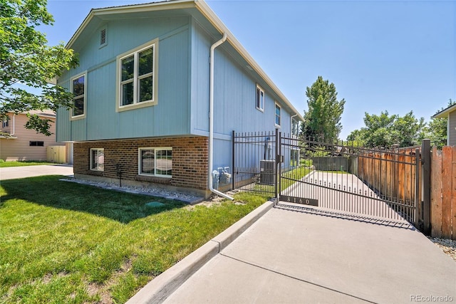 8160 W 81st Pl, Arvada, CO 80005 - view of property exterior with a gate and brick siding