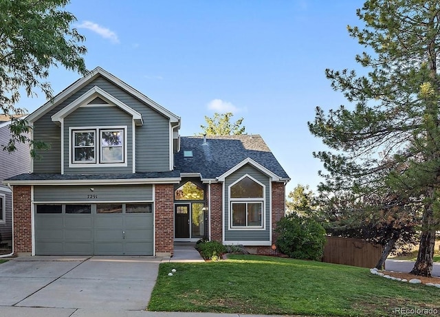 view of front facade featuring a front lawn and a garage