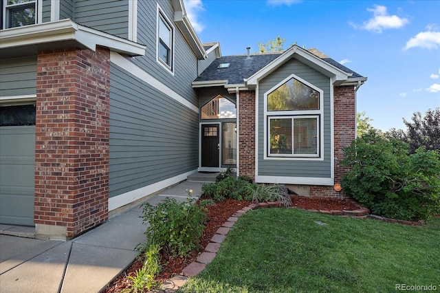 doorway to property with a lawn