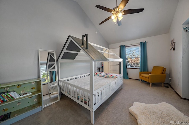 carpeted bedroom with high vaulted ceiling, ceiling fan, and multiple windows