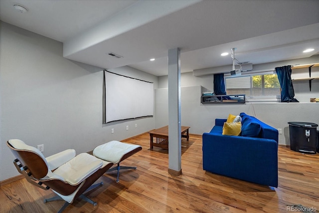 home theater room featuring hardwood / wood-style flooring