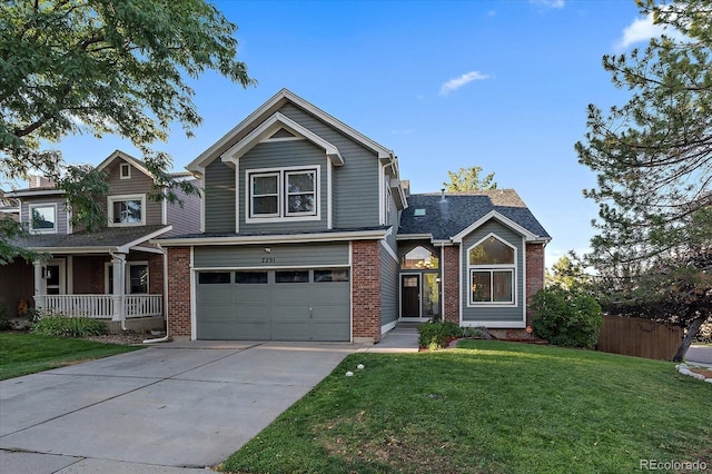 view of front of property featuring a garage, a porch, and a front lawn