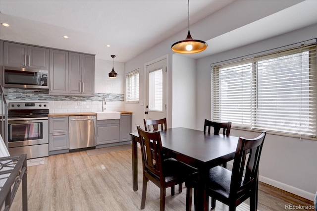 1769 S Lee St Unit B, Lakewood, CO 80232 - dining room featuring light wood-style flooring, recessed lighting, and baseboards