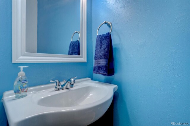 1769 S Lee St Unit B, Lakewood, CO 80232 - bathroom with a sink and a textured wall