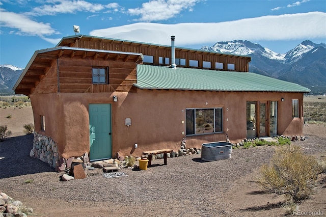 rear view of property with a mountain view