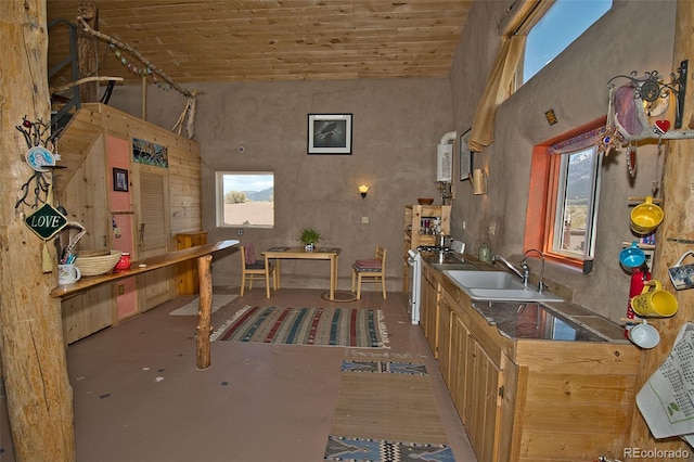 kitchen with sink, wood ceiling, and lofted ceiling