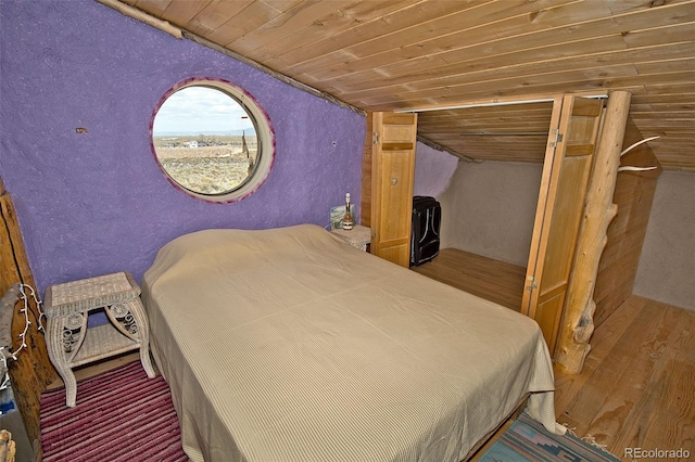 bedroom with wooden ceiling and vaulted ceiling