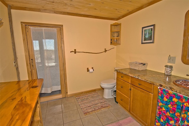 bathroom featuring toilet, vanity, tile patterned floors, and wood ceiling