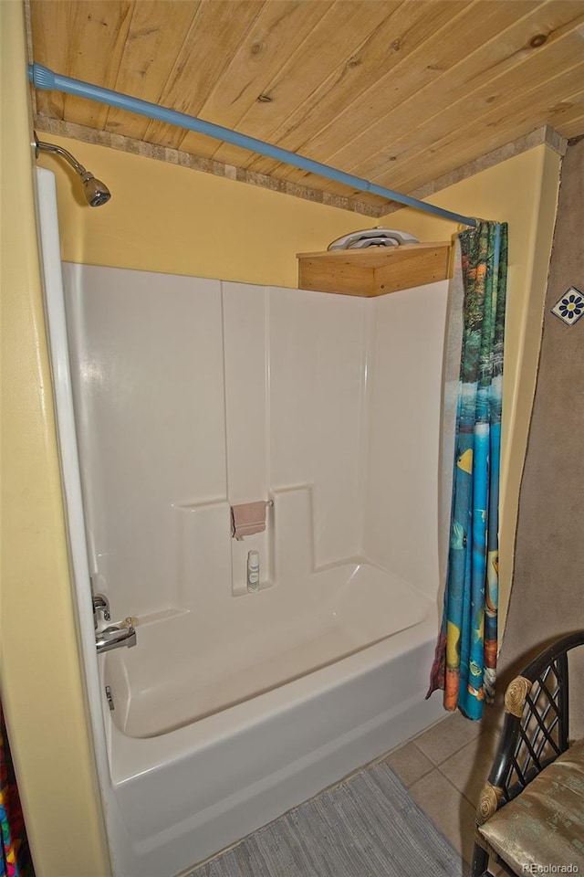 bathroom featuring tile patterned flooring, shower / bath combination with curtain, and wood ceiling