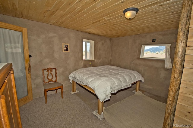 bedroom featuring carpet floors and wood ceiling