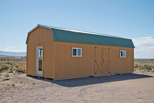 view of outbuilding with a mountain view