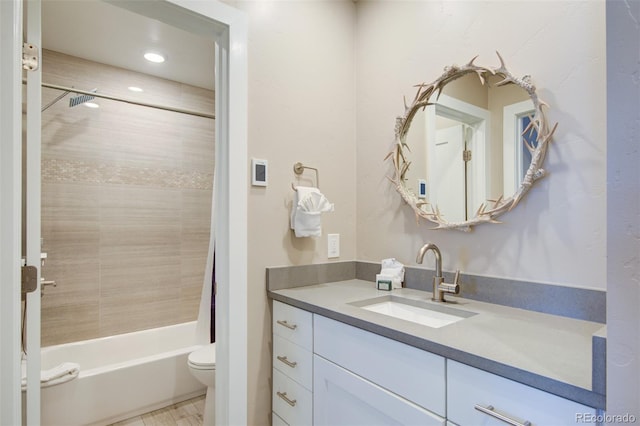 bathroom with toilet, recessed lighting, washtub / shower combination, and vanity