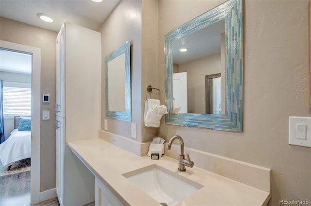 ensuite bathroom featuring vanity and ensuite bath