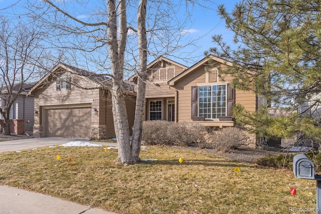 view of front of property featuring a garage and a front lawn