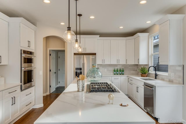 kitchen featuring white cabinets, sink, and stainless steel appliances