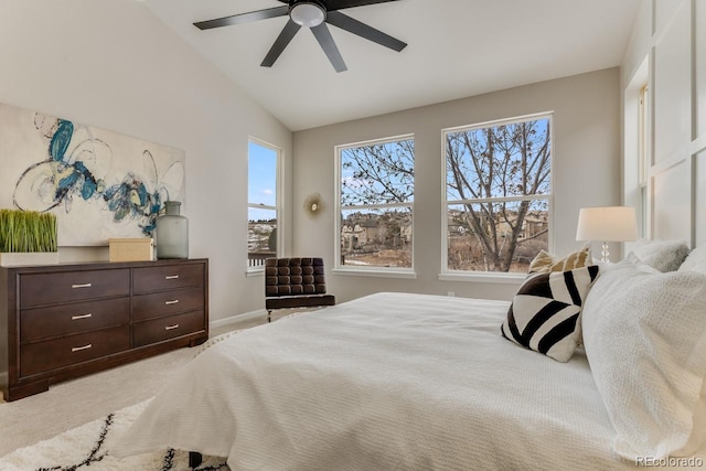 bedroom featuring ceiling fan, light carpet, and lofted ceiling