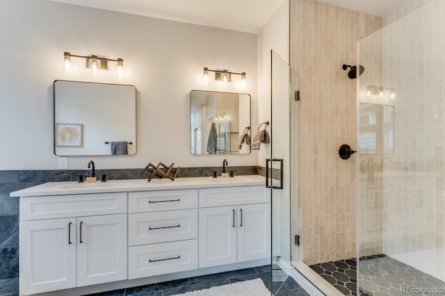 bathroom with walk in shower, vanity, tile walls, and tile patterned floors