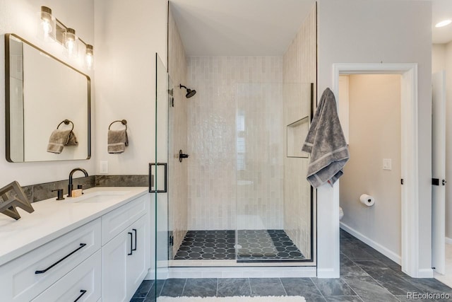 bathroom featuring an enclosed shower, vanity, and toilet