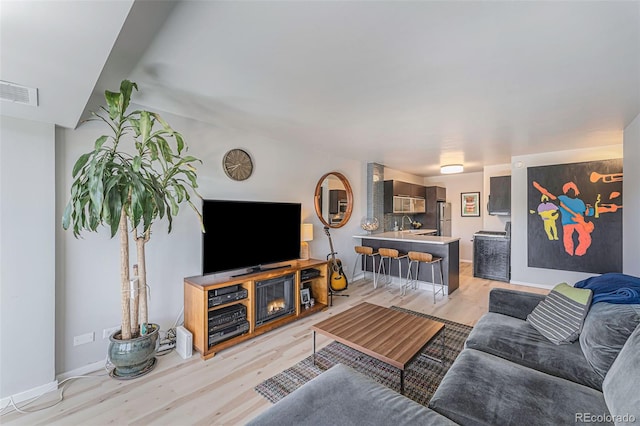 living room with light hardwood / wood-style floors