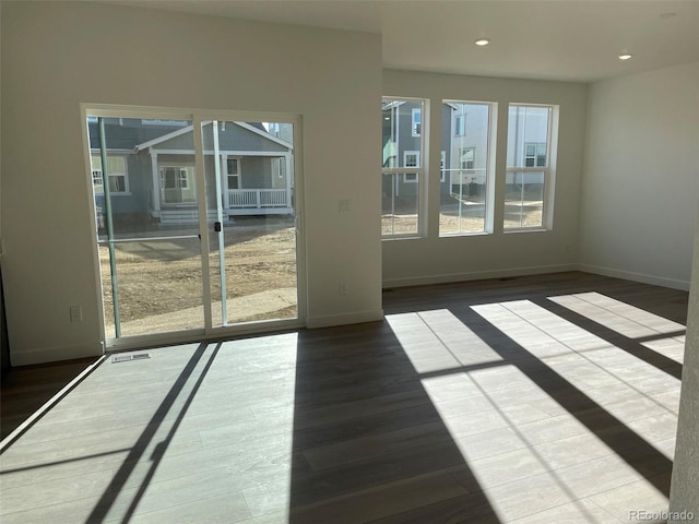 unfurnished room featuring wood-type flooring