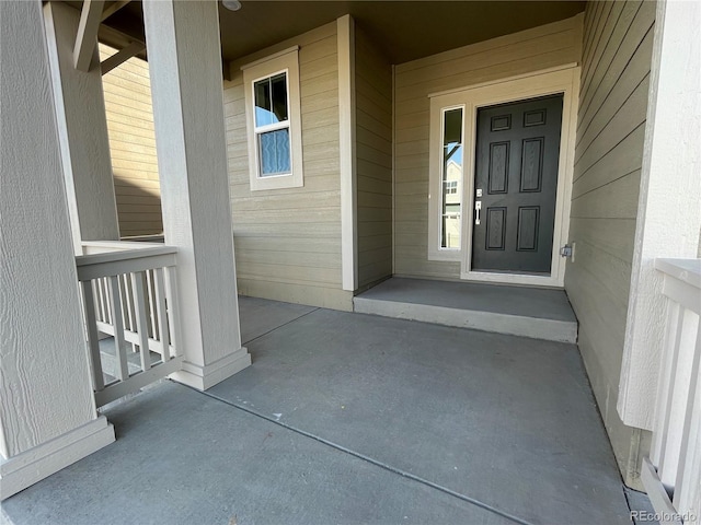 doorway to property featuring covered porch